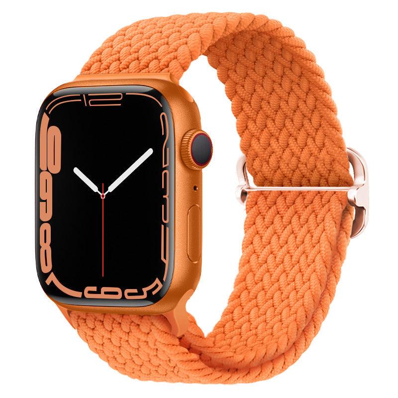 Watchify klokkereim for Apple Watch. En nydelig, komfortabel og elastisk klokkereim med en spenne som ikke er ubehagelig mot huden. Passer Apple Watch series 1/2/3/4/5/6/7. Oransje strikket med sort spenne